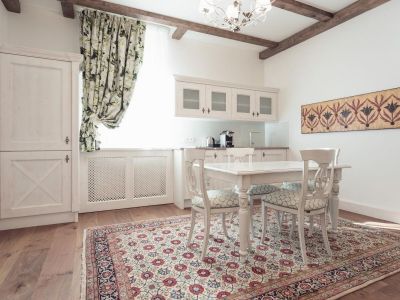 Table with seating and a tea kitchen